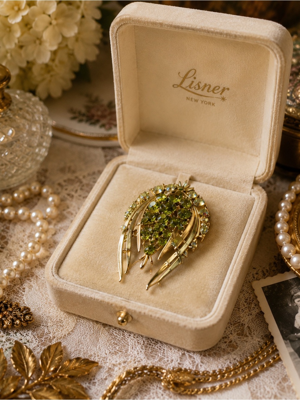 Lisner Green Crystal Leaf Brooch — Gold Tone